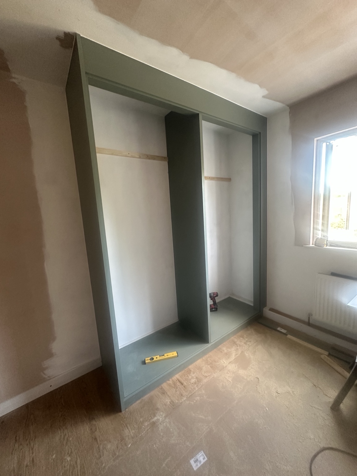 Fitted wardrobe during installation
